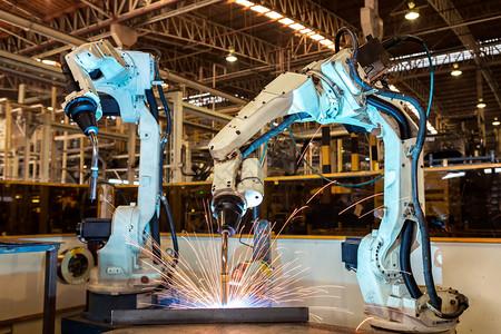 激光焊接车身汽车向前塑料近距离团队机器人在工厂焊接背景